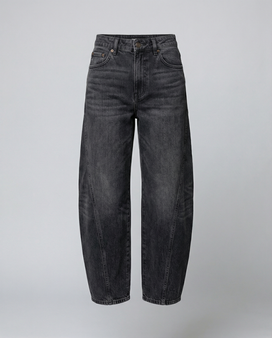 Blue barrel leg jeans with a mid rise waist and rounded slightly flared leg