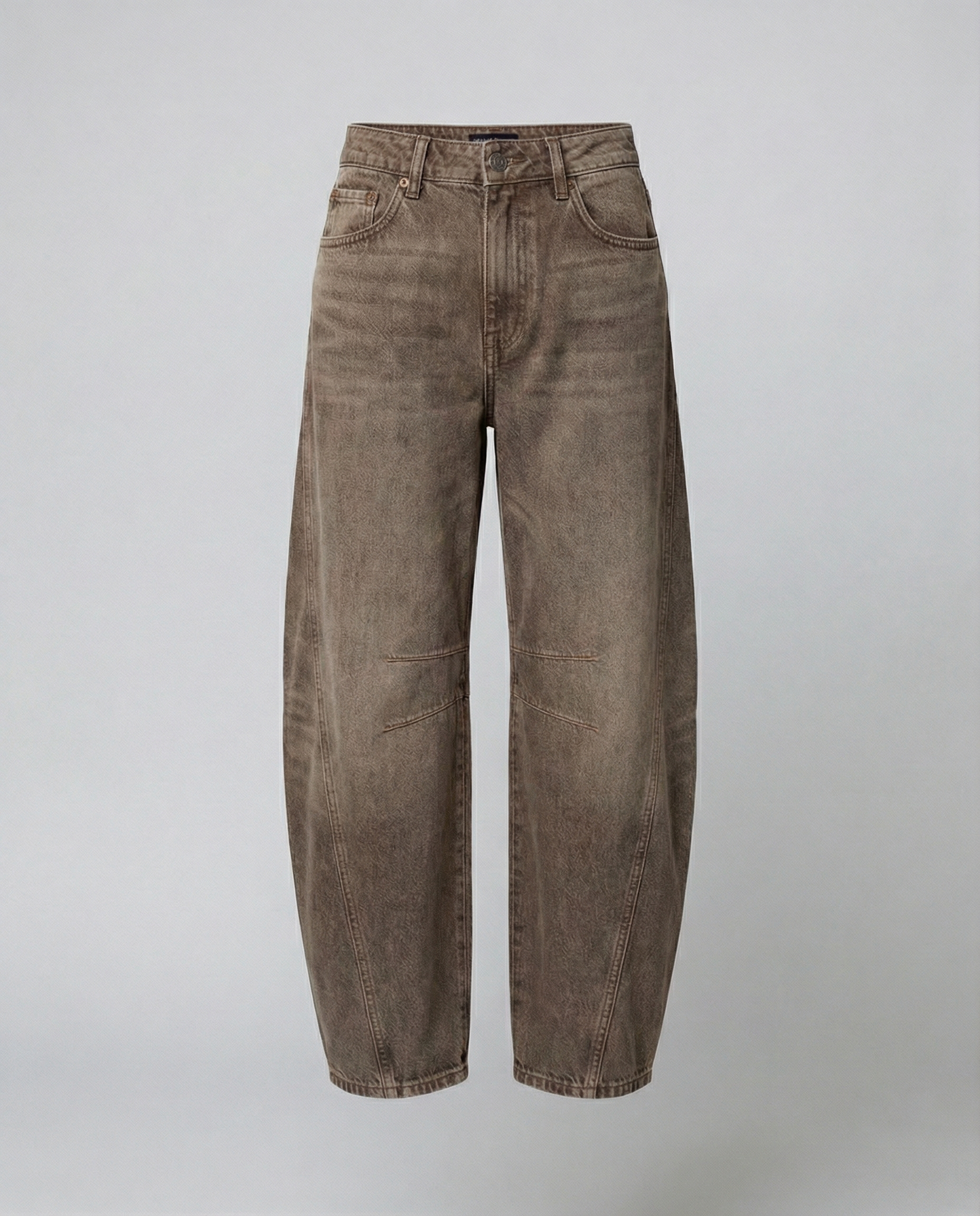 Blue barrel leg jeans with a mid rise waist and rounded slightly flared leg