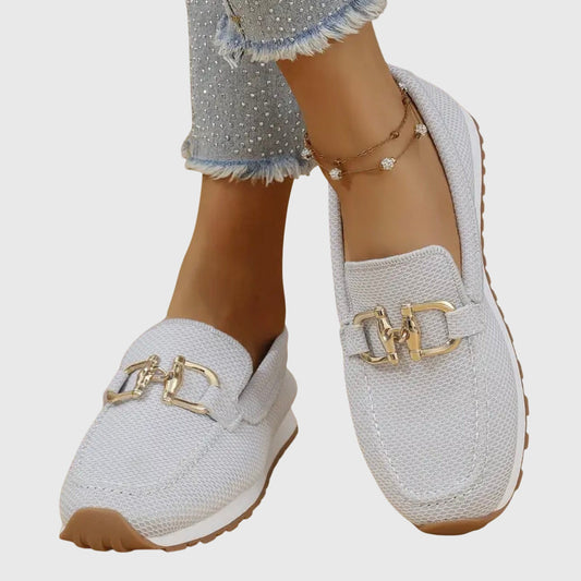 Beige casual slip on loafers with a textured upper and small front hardware detail