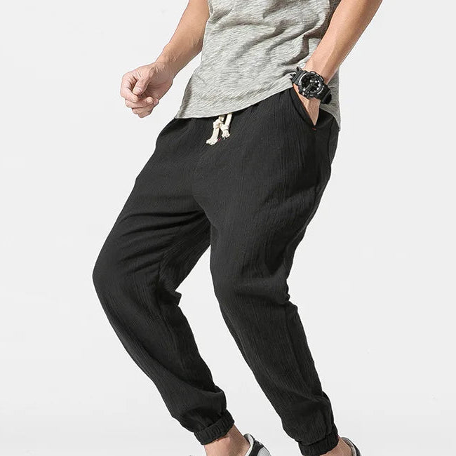 Men's khaki tapered joggers with drawstring waist and ribbed ankle cuffs