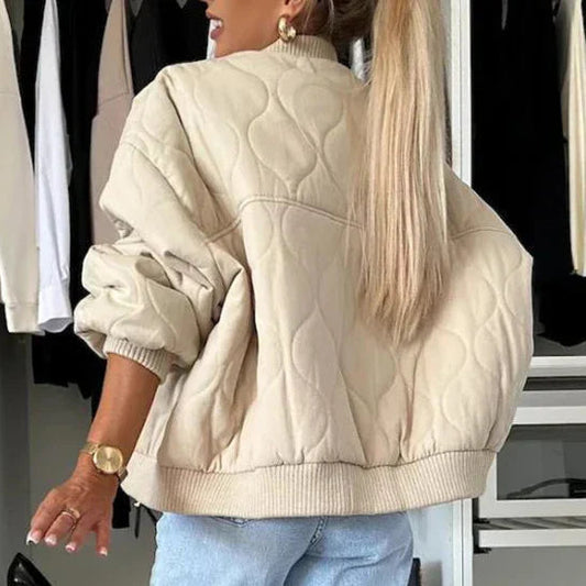 Beige quilted bomber jacket with light padding, lining and long sleeves