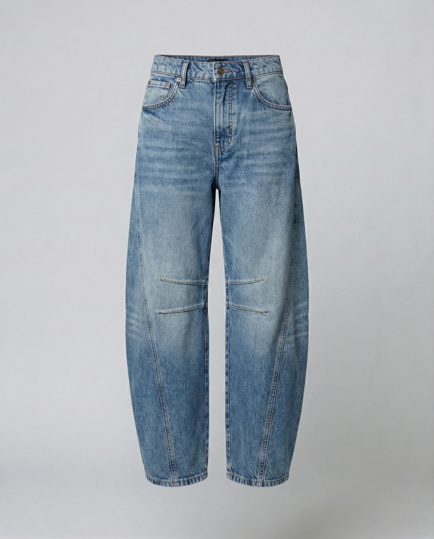 Blue barrel leg jeans with a mid rise waist and rounded slightly flared leg