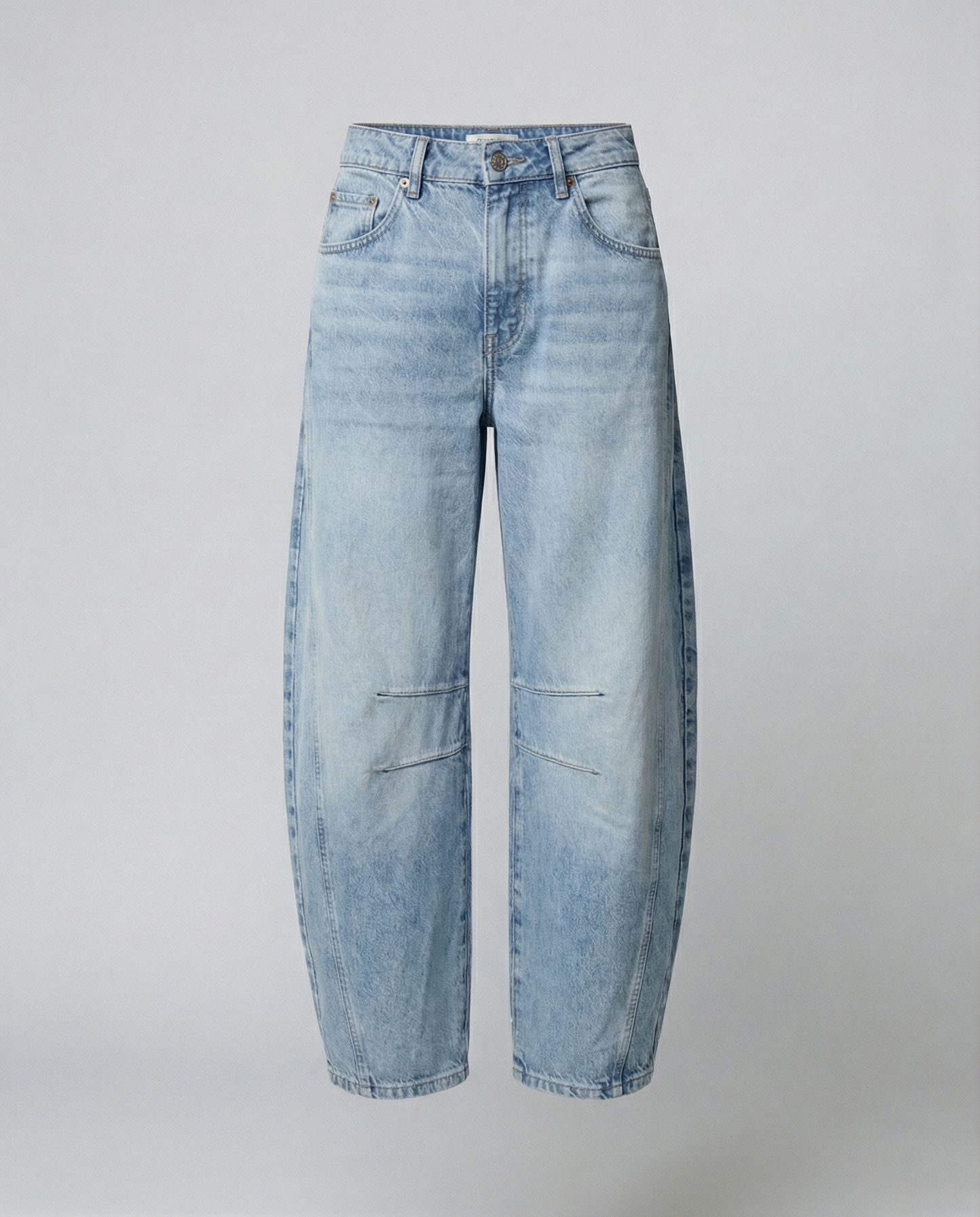 Blue barrel leg jeans with a mid rise waist and rounded slightly flared leg