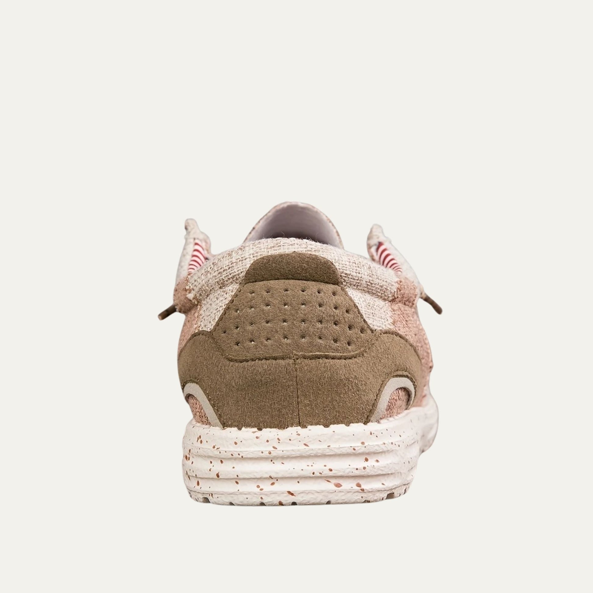 Beige canvas slip on loafers with a speckled rubber sole and a padded collar
