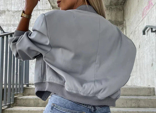 Beige casual bomber jacket with long sleeves and side pockets in a smooth finish