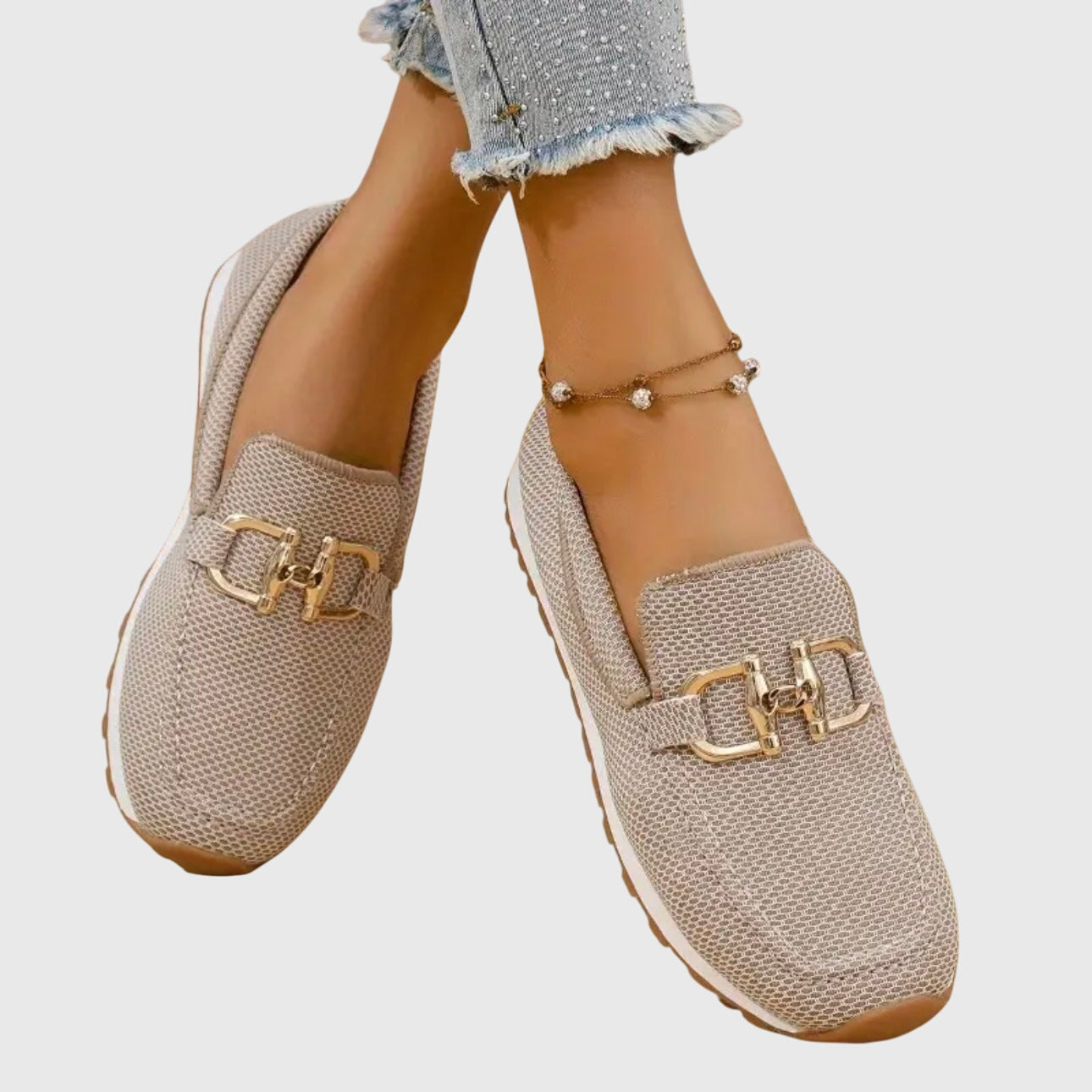 Beige casual slip on loafers with a textured upper and small front hardware detail
