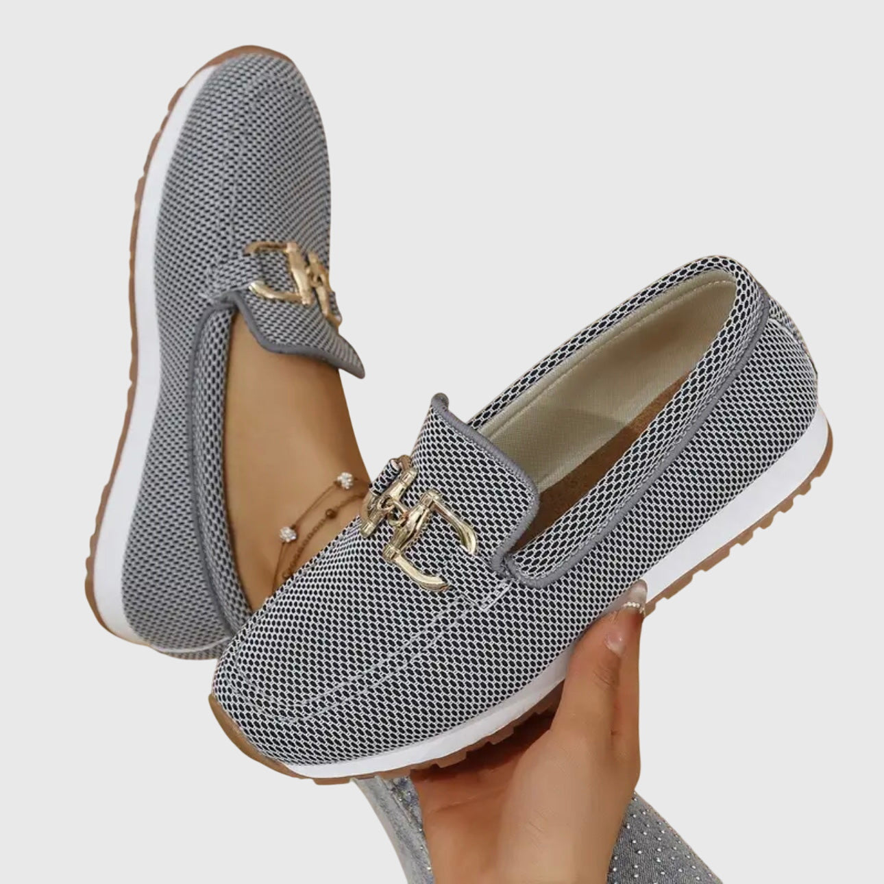 Beige casual slip on loafers with a textured upper and small front hardware detail