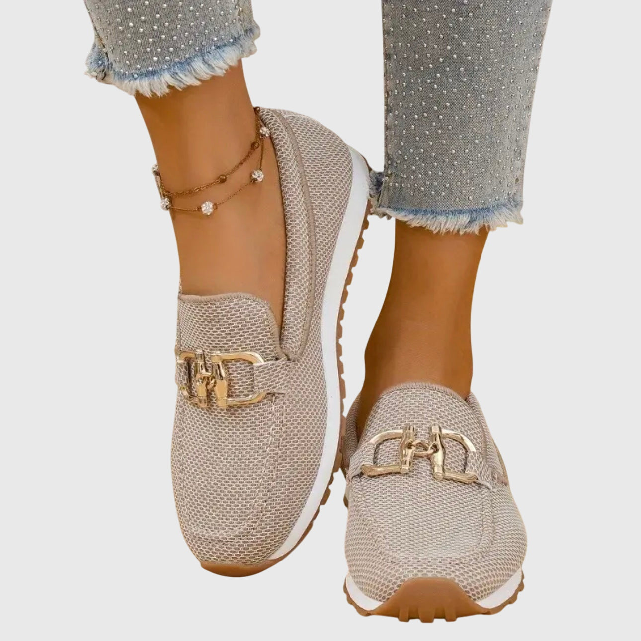 Beige casual slip on loafers with a textured upper and small front hardware detail
