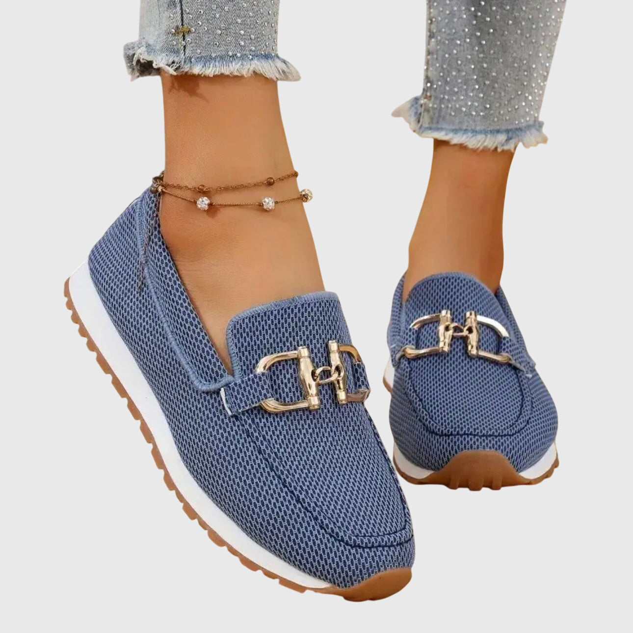 Beige casual slip on loafers with a textured upper and small front hardware detail