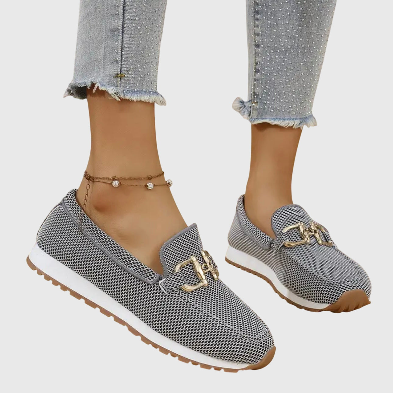 Beige casual slip on loafers with a textured upper and small front hardware detail