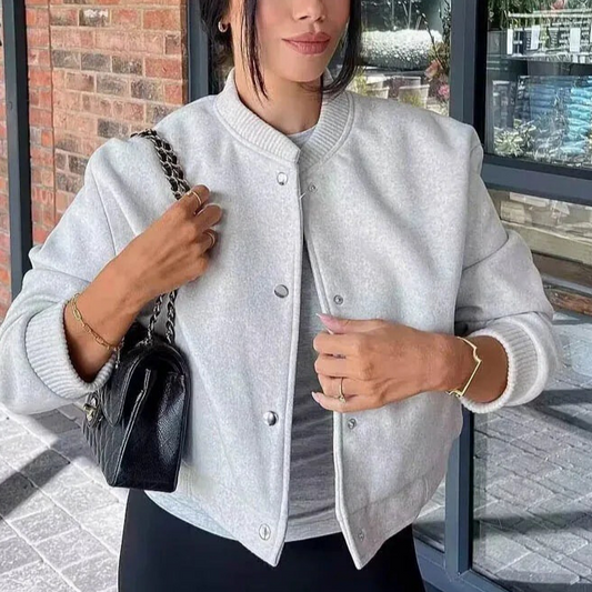 Beige cropped bomber jacket with button front and ribbed cuffs in a slim cut