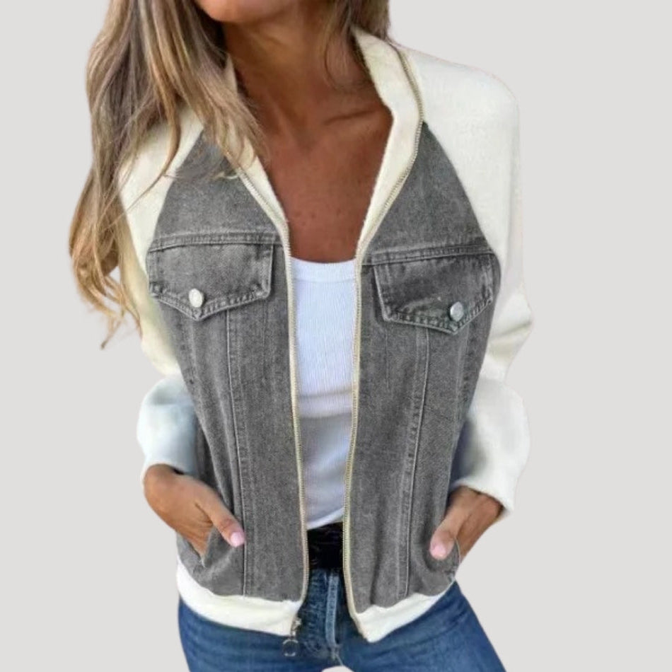 Blue denim bomber jacket with contrasting knit sleeves, chest pockets and front zip