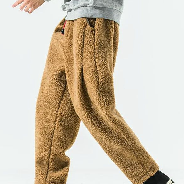 Men's relaxed fleece joggers in brown with a textured surface and drawstring waist