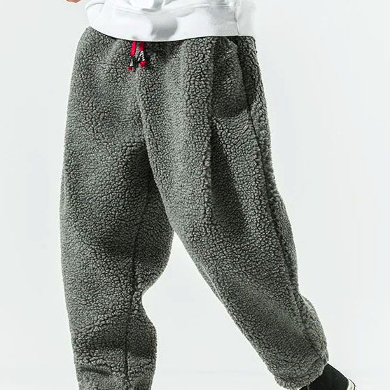 Men's relaxed fleece joggers in brown with a textured surface and drawstring waist