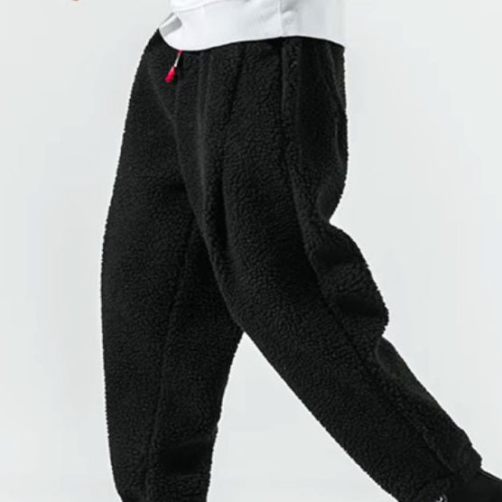 Men's relaxed fleece joggers in brown with a textured surface and drawstring waist
