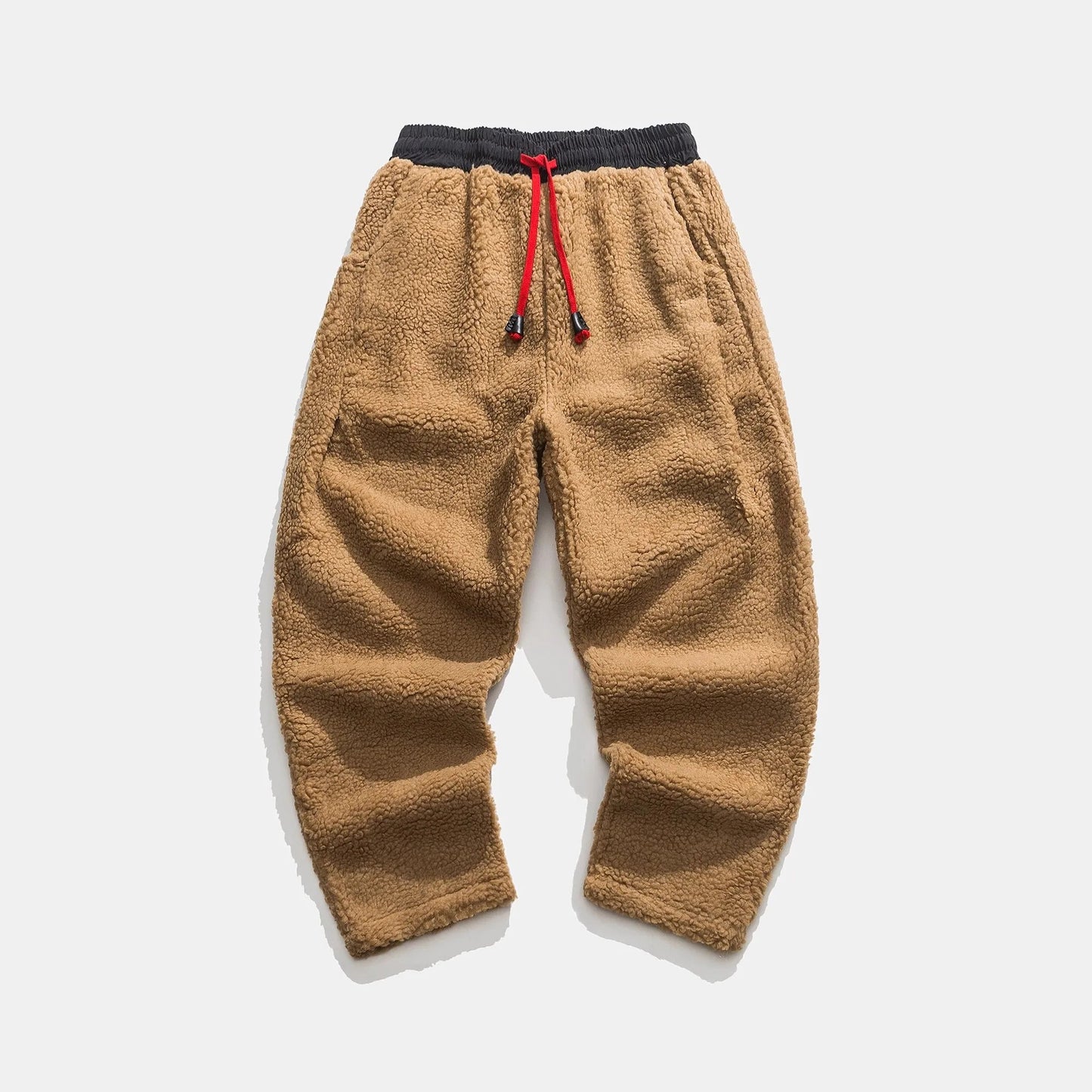 Men's relaxed fleece joggers in brown with a textured surface and drawstring waist