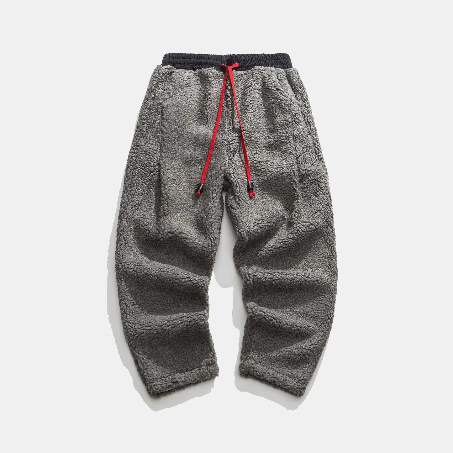 Men's relaxed fleece joggers in brown with a textured surface and drawstring waist