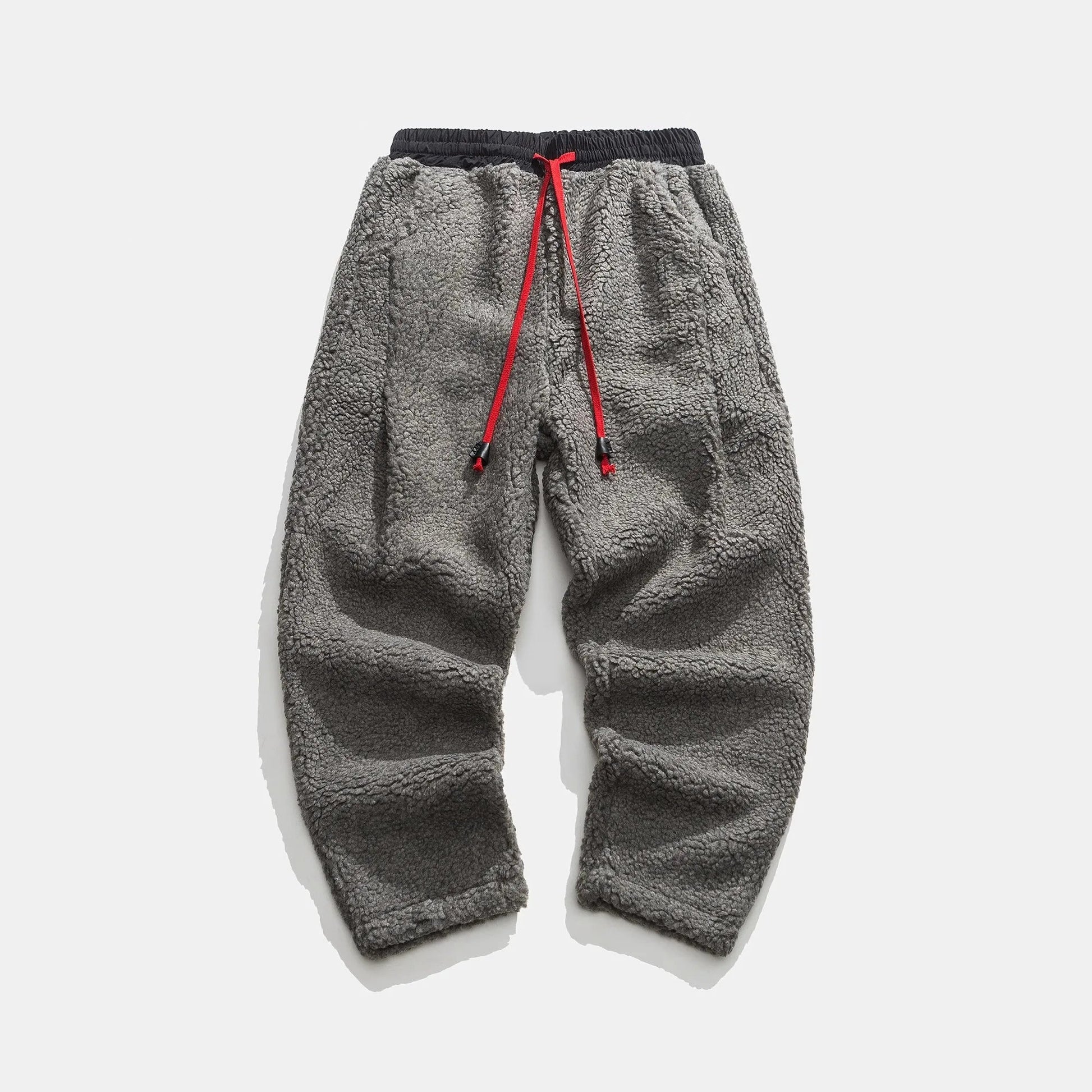 Men's relaxed fleece joggers in brown with a textured surface and drawstring waist