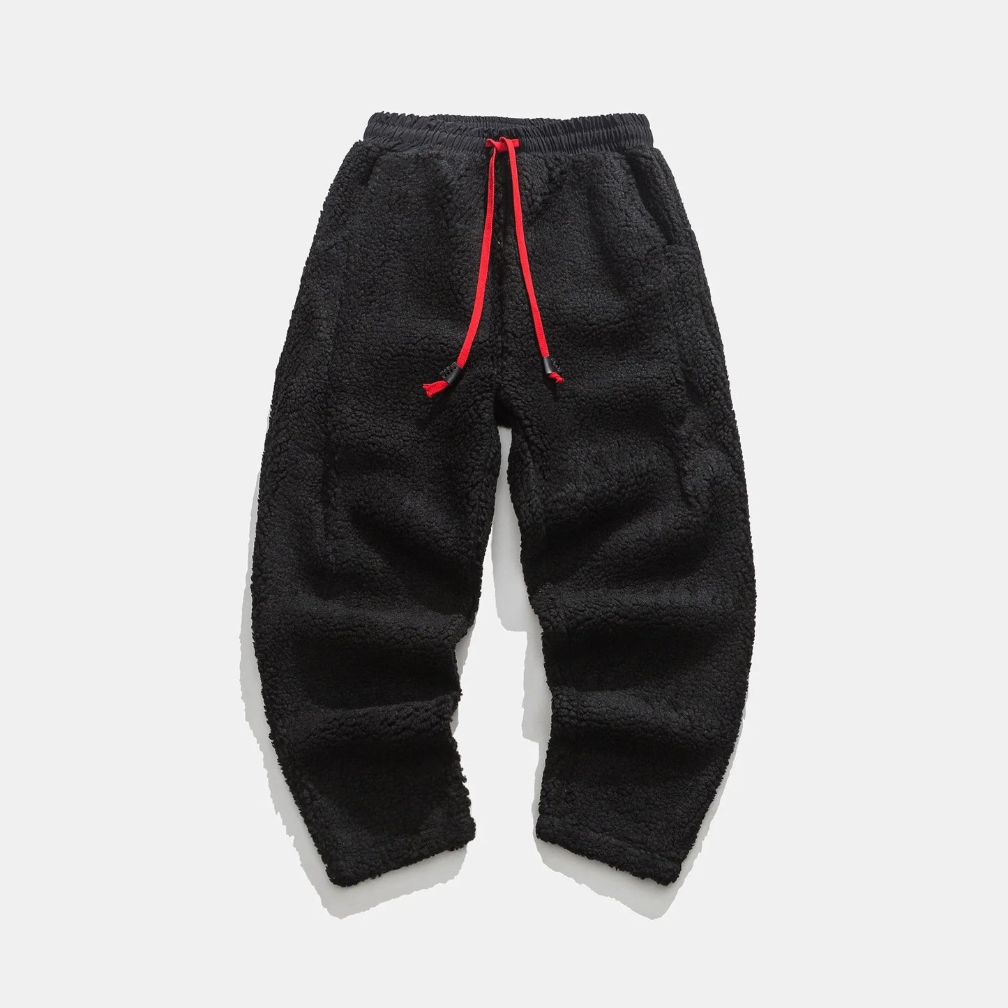 Men's relaxed fleece joggers in brown with a textured surface and drawstring waist