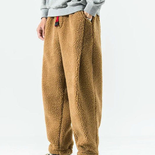 Men's relaxed fleece joggers in brown with a textured surface and drawstring waist