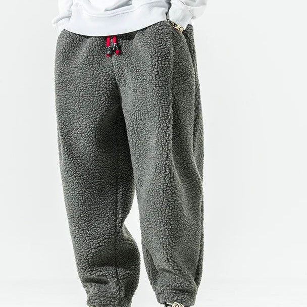 Men's relaxed fleece joggers in brown with a textured surface and drawstring waist
