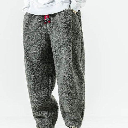 Men's relaxed fleece joggers in brown with a textured surface and drawstring waist
