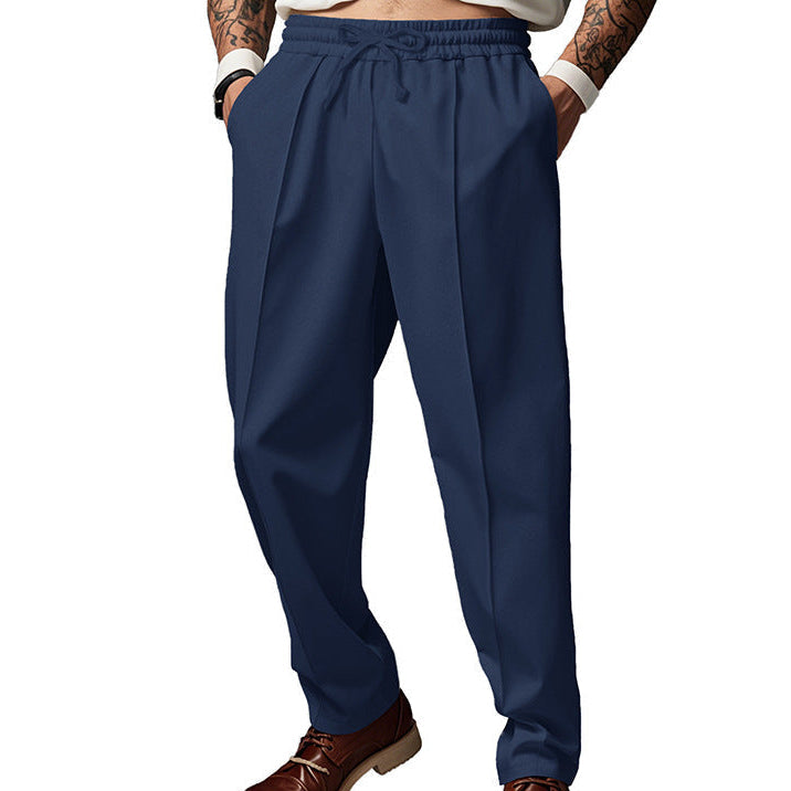 Men's dark grey slim fit joggers with front centre seam and elasticated waistband