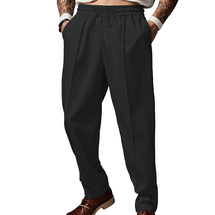 Men's dark grey slim fit joggers with front centre seam and elasticated waistband
