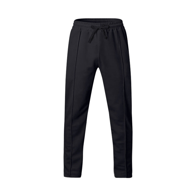 Men's dark grey slim fit joggers with front centre seam and elasticated waistband