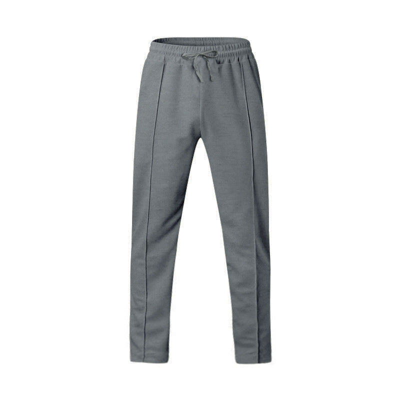 Men's dark grey slim fit joggers with front centre seam and elasticated waistband