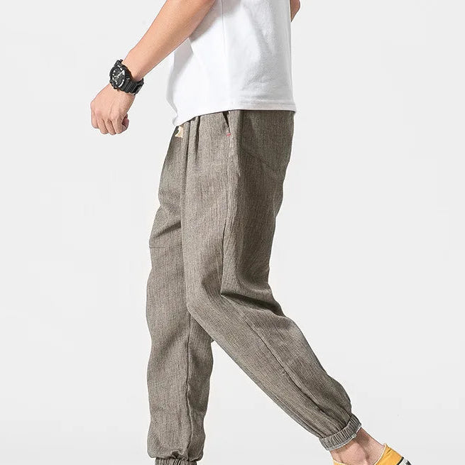 Men's khaki tapered joggers with drawstring waist and ribbed ankle cuffs