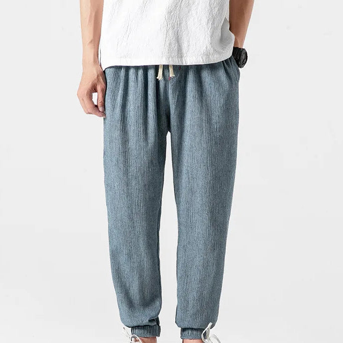 Men's khaki tapered joggers with drawstring waist and ribbed ankle cuffs