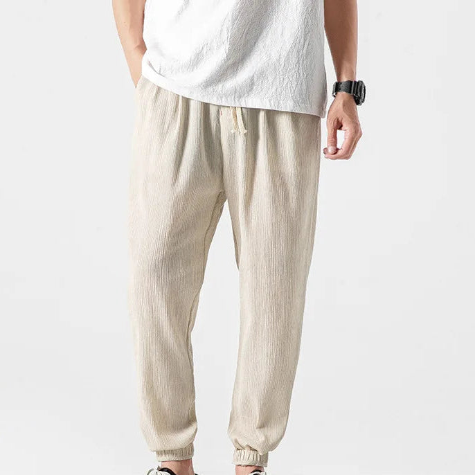 Men's khaki tapered joggers with drawstring waist and ribbed ankle cuffs