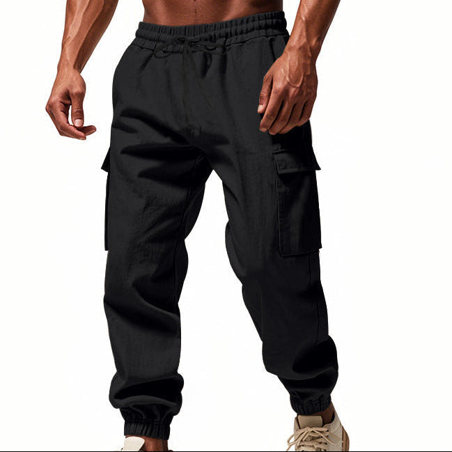 Men's tapered utility joggers in black with flap thigh pockets and elasticated cuffs