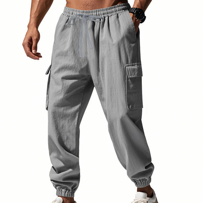Men's tapered utility joggers in black with flap thigh pockets and elasticated cuffs