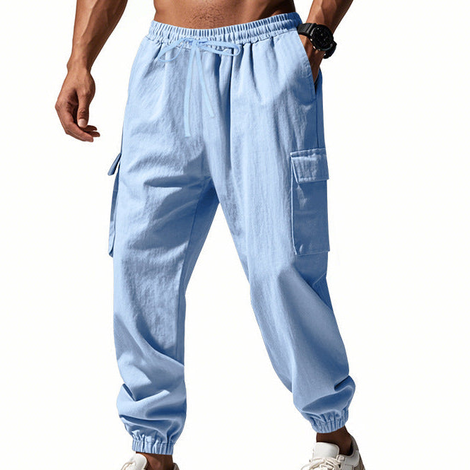 Men's tapered utility joggers in black with flap thigh pockets and elasticated cuffs