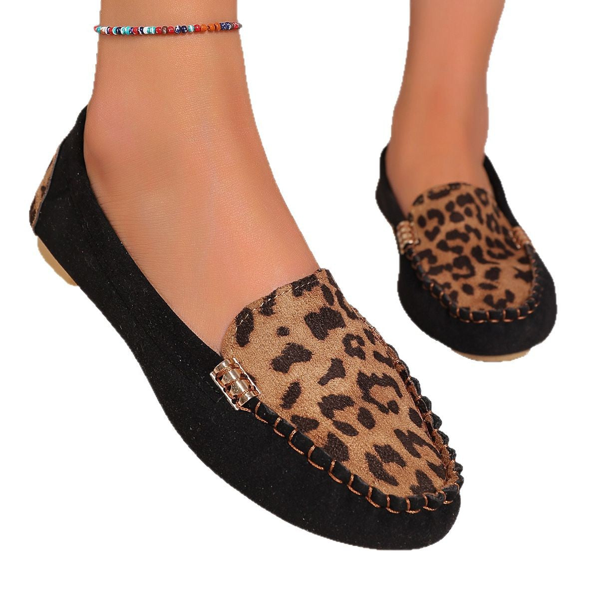 Brown leopard print moccasin loafers with decorative stitching and a studded sole