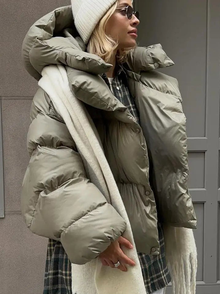 Grey oversized cropped puffer jacket with a deep padded collar and quilted shell