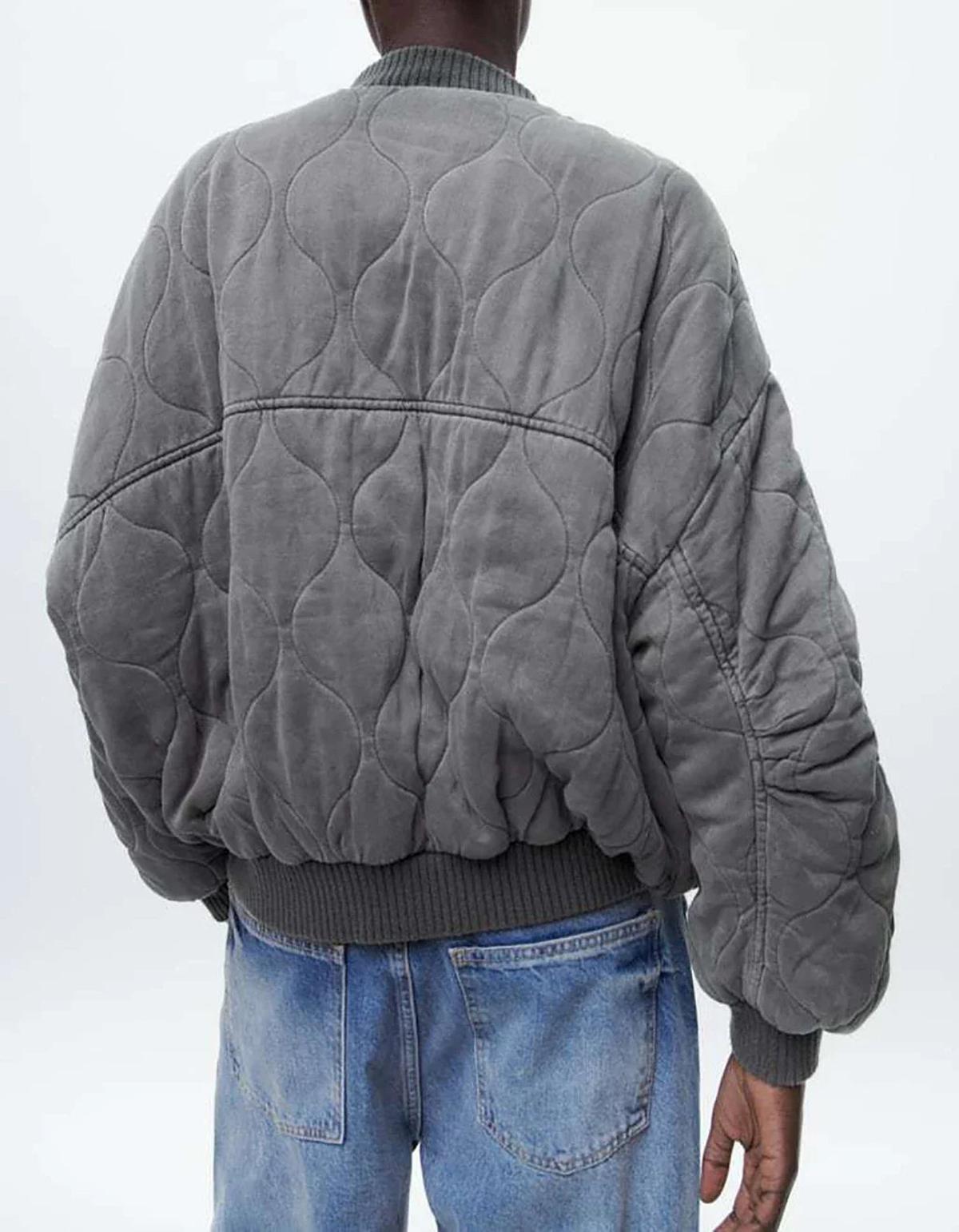 Grey oversized bomber jacket with long sleeves and a roomy relaxed shape