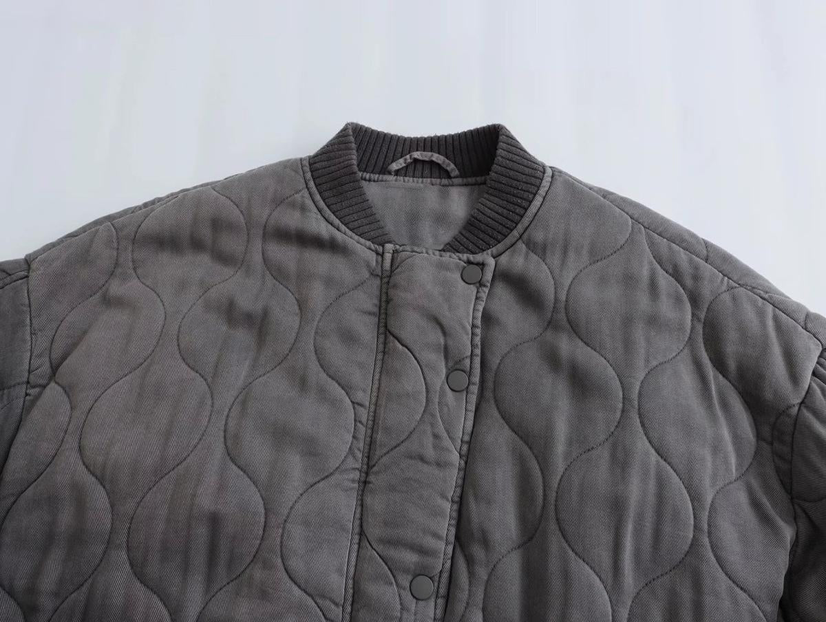 Grey oversized bomber jacket with long sleeves and a roomy relaxed shape