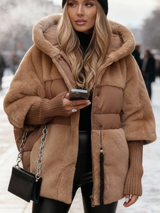 Brown oversized hooded puffer jacket with faux fur panels and a quilted padded body