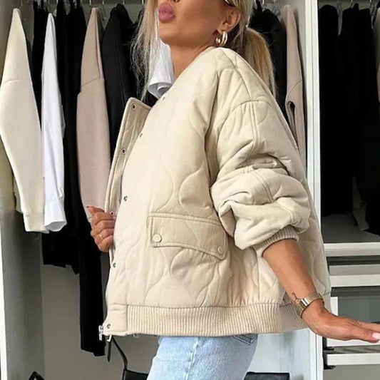 Beige quilted bomber jacket with light padding, lining and long sleeves