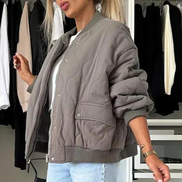 Beige quilted bomber jacket with light padding, lining and long sleeves