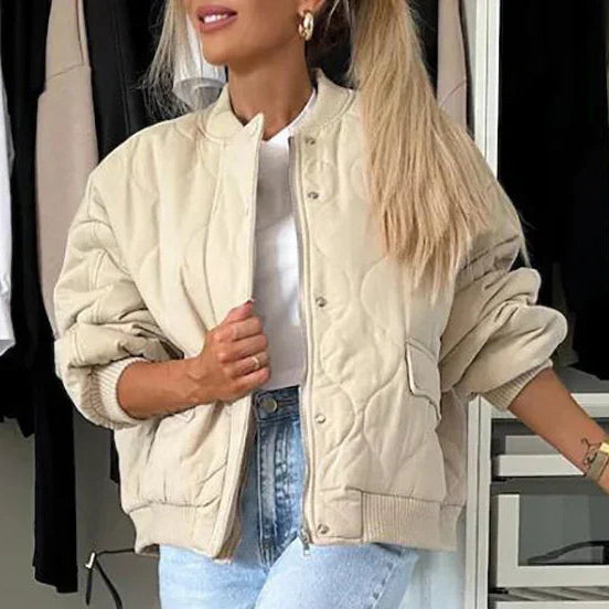 Beige quilted bomber jacket with light padding, lining and long sleeves