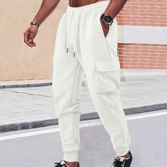Men's light grey quilted cargo joggers with waffle texture and patch flap pockets