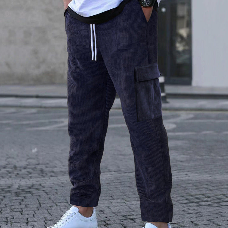 Men's relaxed corduroy joggers in brick red with patch flap pockets and a straight leg