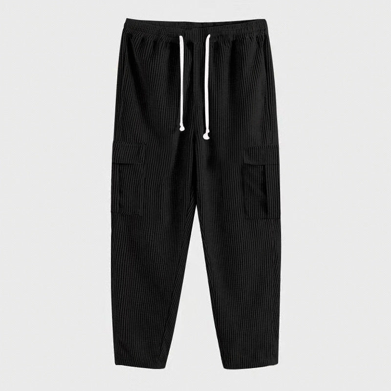 Men's relaxed corduroy joggers in brick red with patch flap pockets and a straight leg