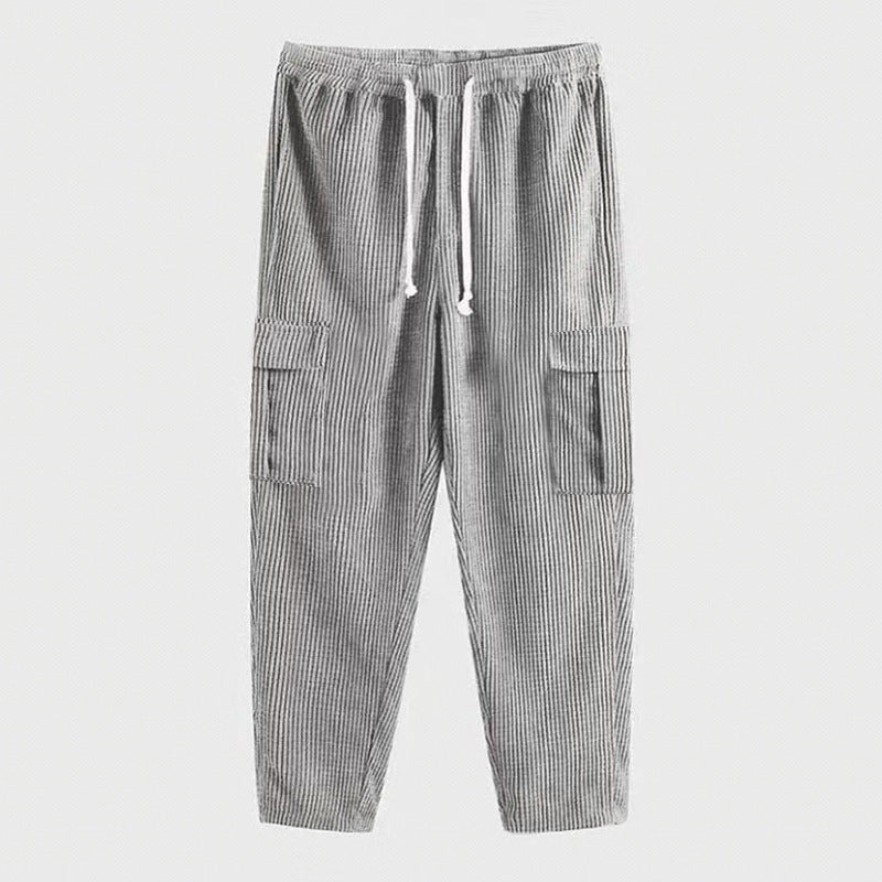 Men's relaxed corduroy joggers in brick red with patch flap pockets and a straight leg