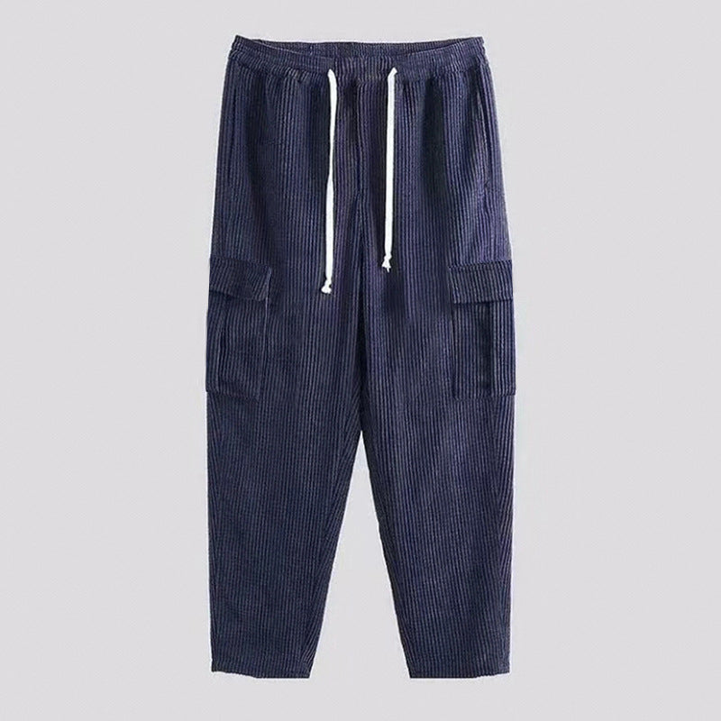 Men's relaxed corduroy joggers in brick red with patch flap pockets and a straight leg