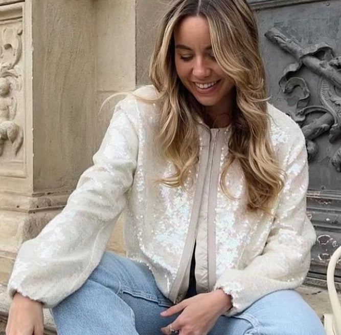 Cream sequin bomber jacket with long sleeves, round neckline and full length zip